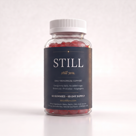 Still You Peri Night Gummies bottle beside ruby-red gummies on a cream studio background